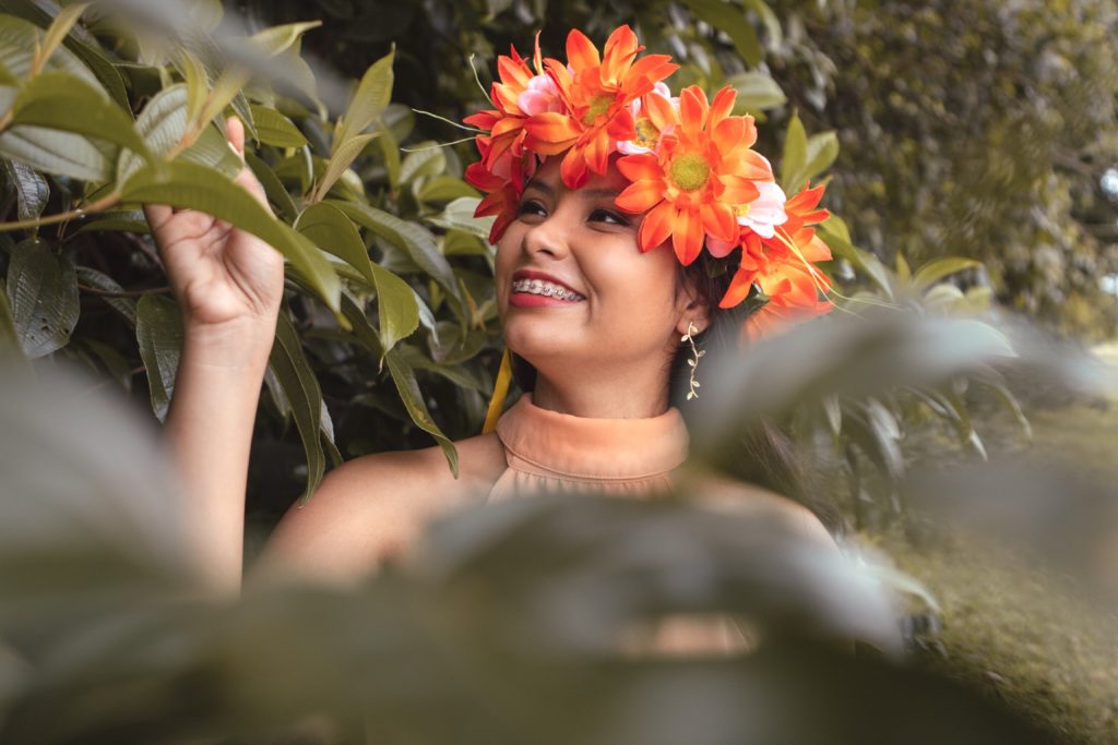 https://www.pexels.com/photo/smiling-woman-wearing-orange-floral-headdress-2232897/